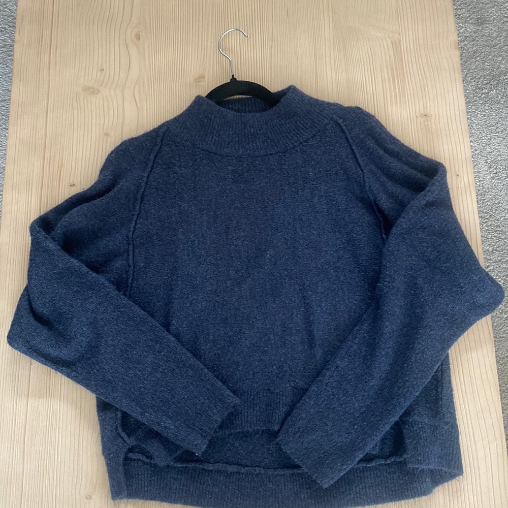 Navy knit sweater. Very light and comfortable
